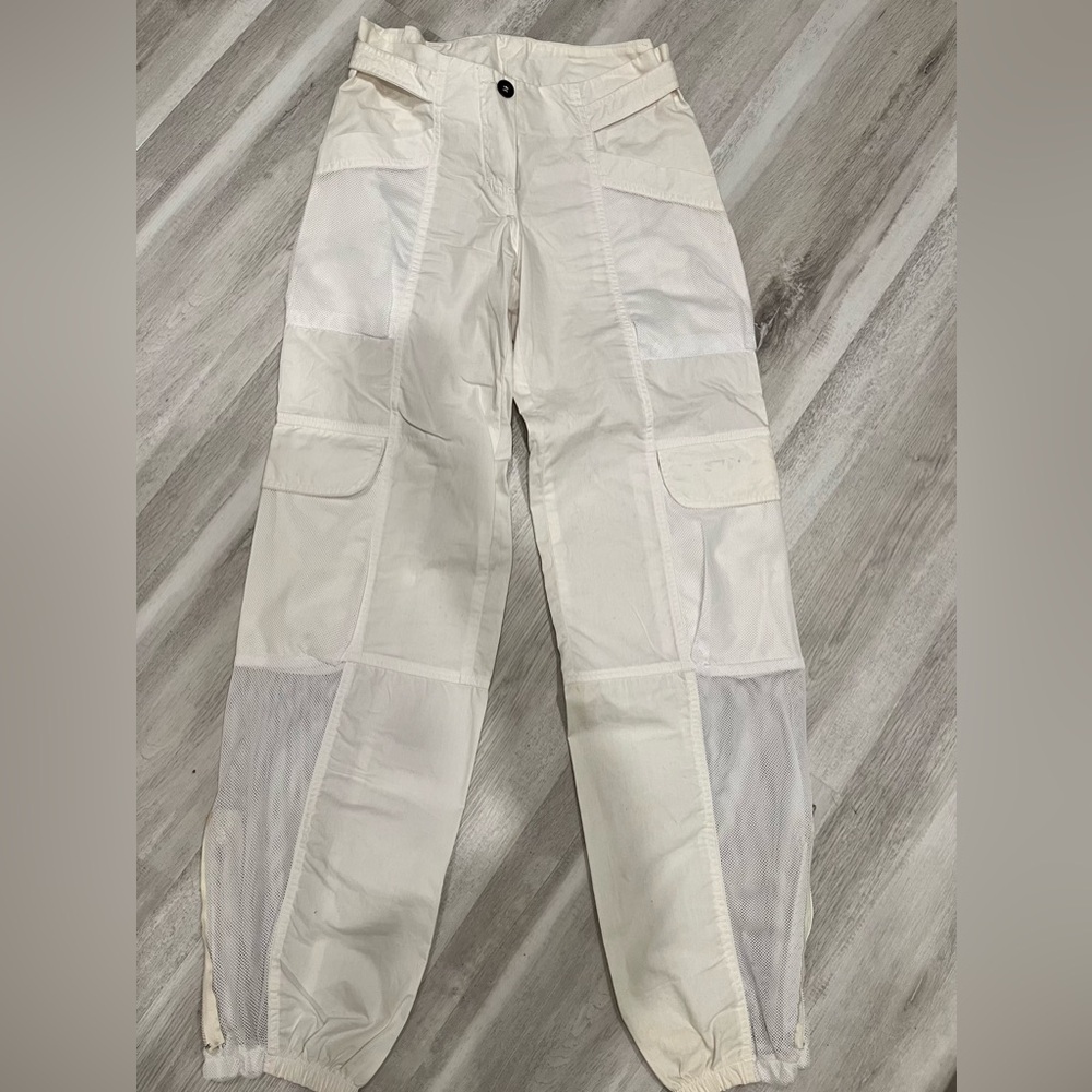 White Cargo pants w/ netting accents & zipper at ankles. Size (European size 6)